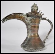 A believed 18th century Middle Eastern Persian Islamic copper and brass Dallah coffee pot with