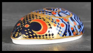 A Royal Crown Derby imari pattern Computer Mouse paperweight having gold stopper. Measures 4 cm