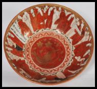 A 19th century Japanese Meiji period Satsuma ware bowl having ocher red hand painted decoration of