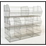 A retro 20th century wirework shop - grocers display stand.  The modular stacking system with