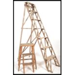 An early 20th century wooden trellis - lattice worked Industrial step ladder. Ideal as conversion to