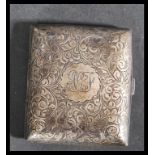 A silver hallmarked hinged chase decorated cigarette case, assay marks for Birmingham, dating to