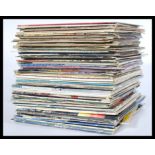 A large collection of vinyl long play / LP vinyl record albums featuring many artists to include The