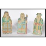 A group of three early 20th century carved wooden Chinese figures of deities / elders in coloured