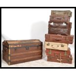 A collection of vintage 20th Century suitcases to include leather examples together with a vintage