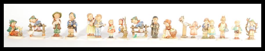 A good collection of 20th century German Hummel figurines to include many examples of small boys and