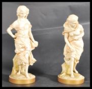 A pair of Royal Worcester James Hadley ivory blush figurines of maidens entitled Before and