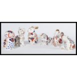 A collection of six imari pattern ceramic paperweights in the form of animals to include dog , cat ,