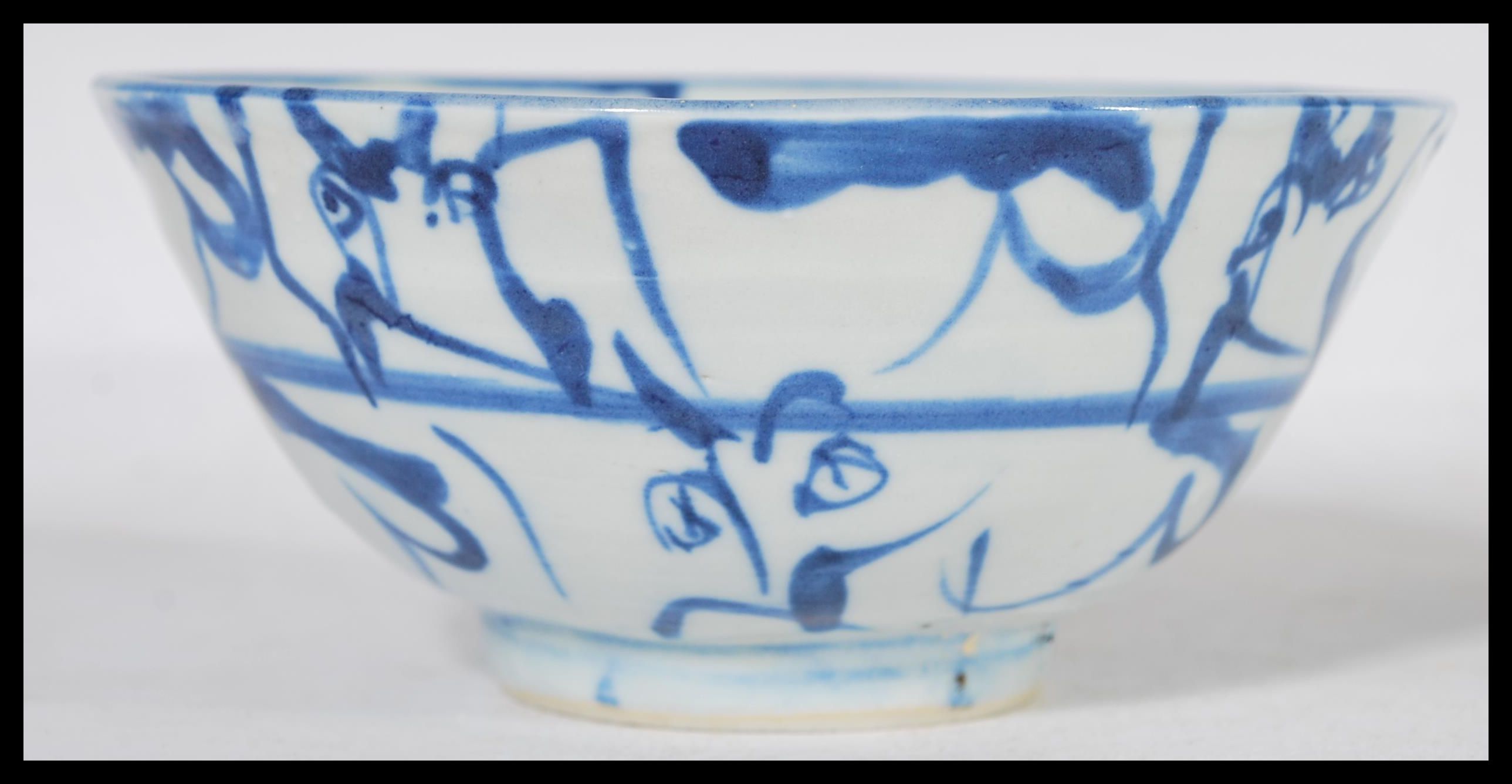 A 19th century Chinese pottery bowl raised on a small circular foot with hand painted decoration - Image 2 of 6