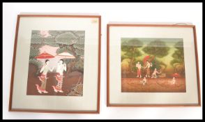 A pair of framed and glazed Indian / Asian watercolour paintings on silks depicting semi clad ladies