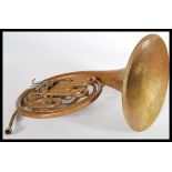 A vintage early 20th century copper and white metal French Horn of typical form. Please images.