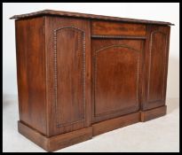 A 19th century Georgian mahogany side cabinet having two tall cupboards with central recessed