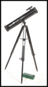 A 20th Century Tasco Telescope on tripod stand together with optics and accessories.