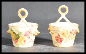 A pair of Royal Worcester tapering cylindrical buckets having crossed rope handles, printed and