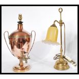 A 19th century Regency copper samovar converted to a table lamp along with a vintage brass