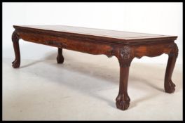 A Chinese mid century rosewood coffee table of rectangular form inset with soapstone relief