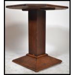 An early 1920's oak Art Deco centre / occasional table, octagonal top raised on a square support