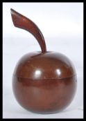 An early 20th century Edwardian tea caddy in the form of an apple with elongated stem and leaf.