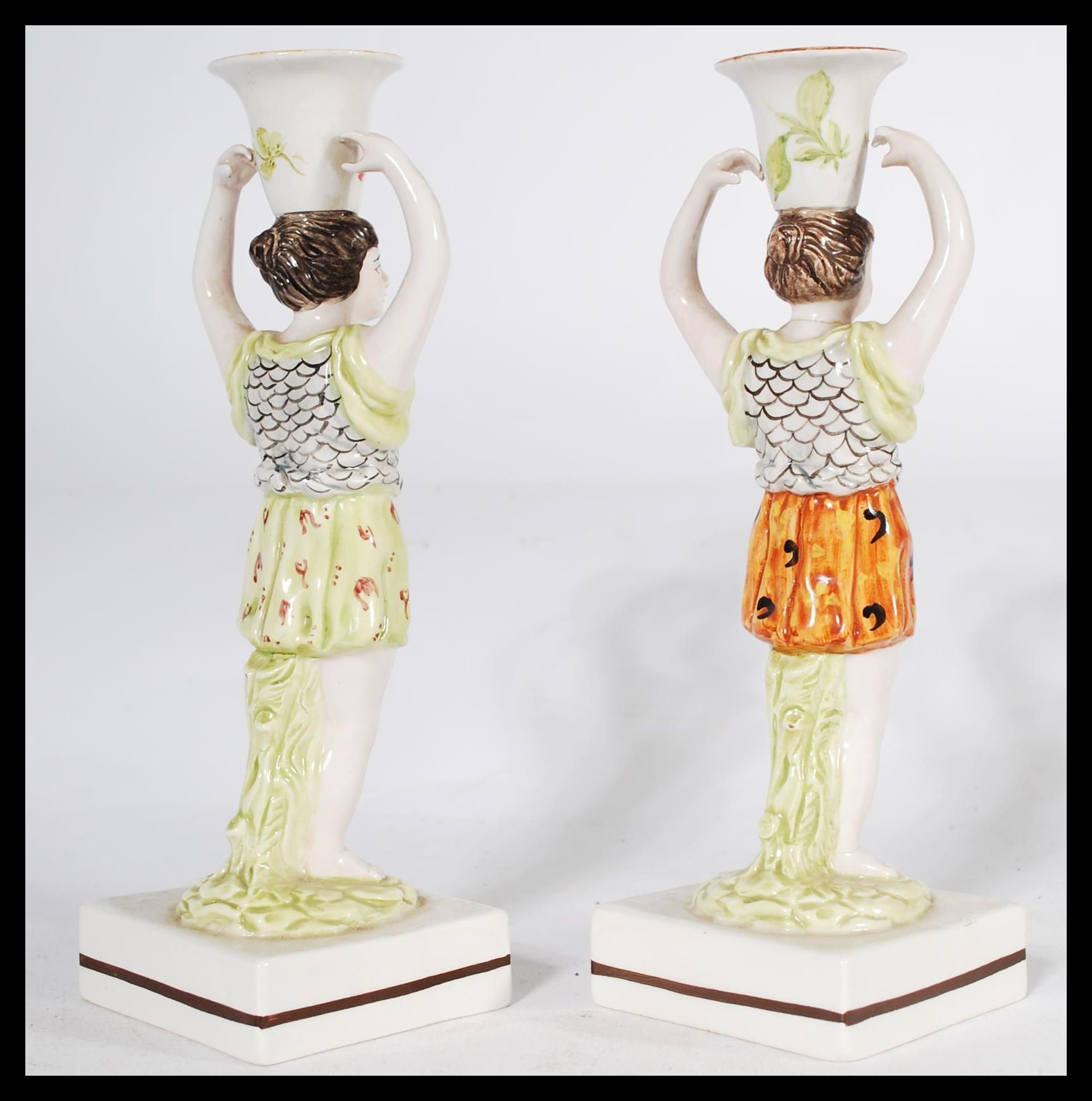 A pair of 19th century Staffordshire figural candlestick holders raised on square bases in the - Image 3 of 6