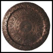 A 19th Century Victorian Persian / Middle Eastern copper worked charger of large proportions,