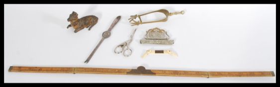 A collection of vintage items to include a wooden slide rule , spelter figurine of a goat ,