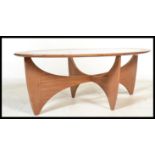 A G-Plan 20th century teak wood coffee table table having a shaped top being raised on a space age