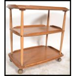 A retro 1970's vintage 20th century Ercol 3 tier butlers serving buffet trolley. Light beech and elm