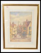 Maud Fisher - A 20th century watercolour street scene painting of  Bristol being framed and
