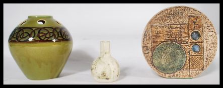 A group of vintage studio pottery to include a Troika Wheel vase , a Carn Penzance pottery