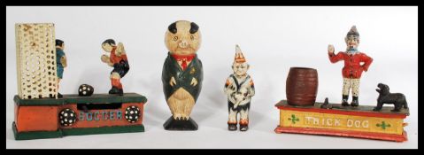 A collection of vintage style cast metal money boxes to include footballers, dog, pig and a clown.
