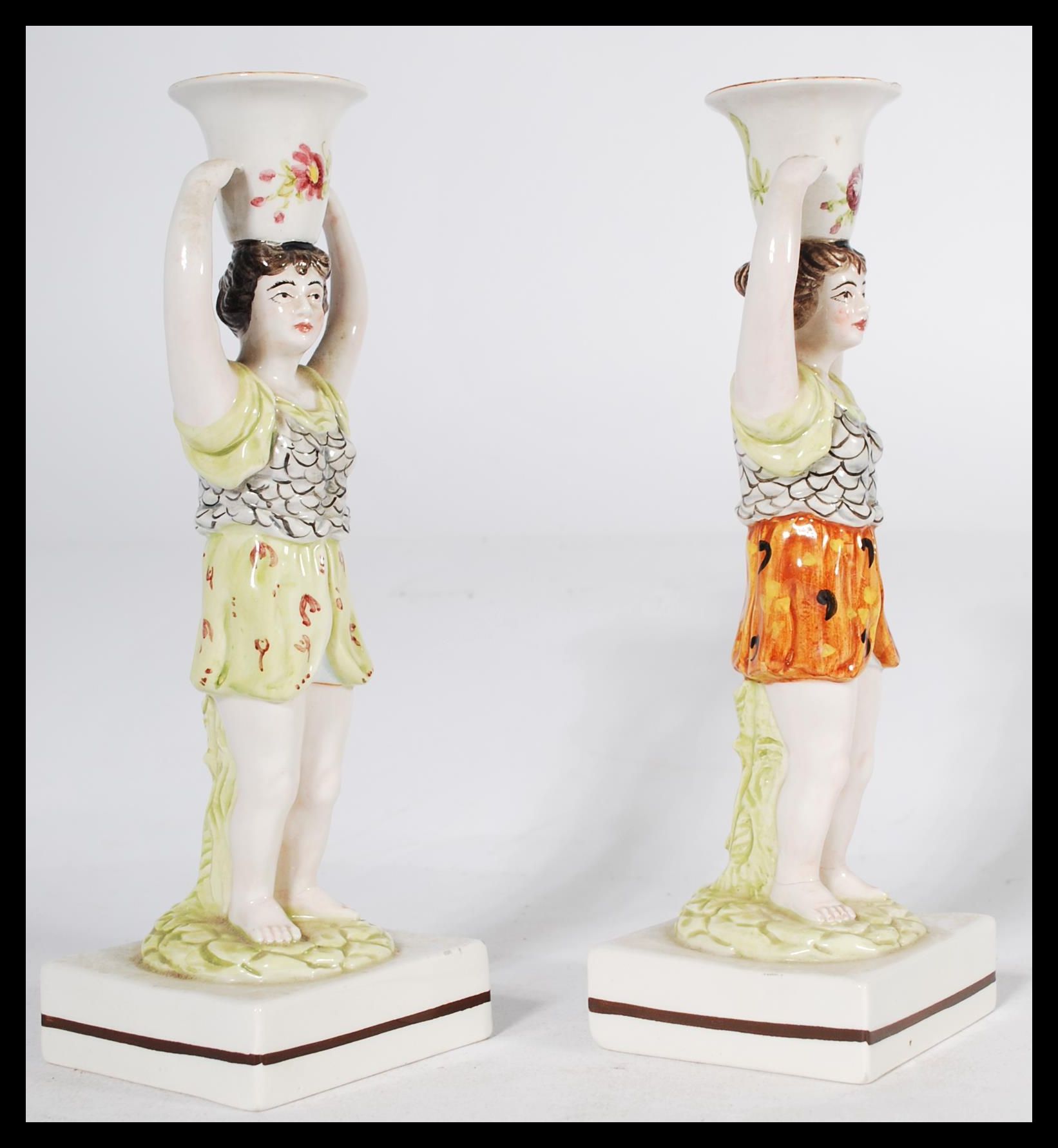 A pair of 19th century Staffordshire figural candlestick holders raised on square bases in the - Image 4 of 6