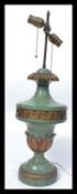 An early 20th century coaching lamp having verdigris coloured ceramic body with gilt embeliished
