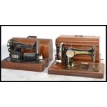 2 early 20th century sewing machines by Singer. Both with the original carry cases of mahogany
