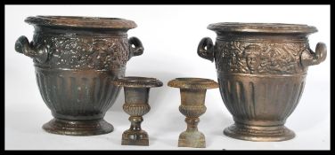 A pair of weathered early 20th Century cast metal