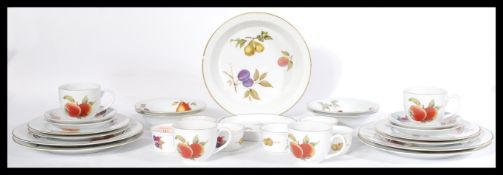 A Royal Worcester Evesham pattern part dinner / tea service comprising cups, saucers, plates,