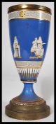 A 19th century Victorian cobalt vase having classical scenes of figures , cherubs and musicians with