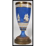 A 19th century Victorian cobalt vase having classical scenes of figures , cherubs and musicians with