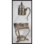 A vintage 20th Century silver plated and glass coffee carafe spirit warmer