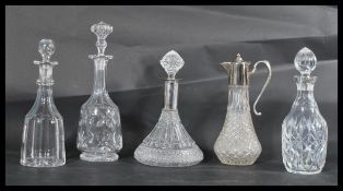 A group of four cut glass decanters dating from the 19th century along with a good quality cut glass