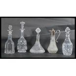 A group of four cut glass decanters dating from the 19th century along with a good quality cut glass