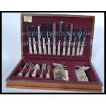 A 20th century cased canteen of cutlery being fully appointed and complete set to a baize lined