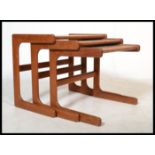 A vintage retro 20th century Danish influence set of teak cantilever coffee tables in the manner