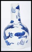 A 19th century blue and white Chinese baluster vase. The bulbous body having elongated neck with