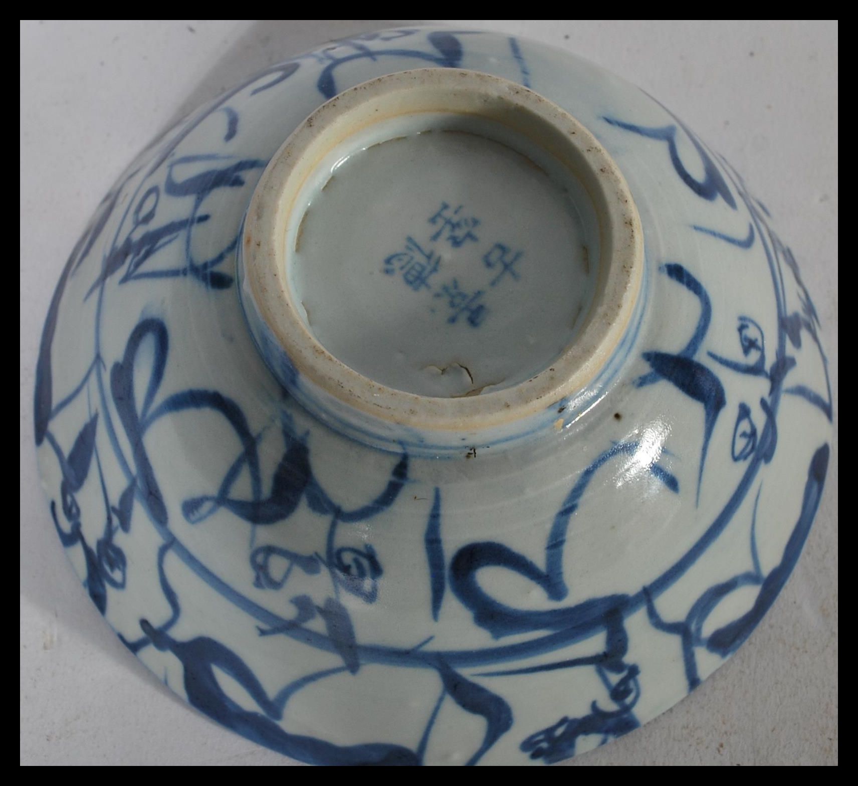 A 19th century Chinese pottery bowl raised on a small circular foot with hand painted decoration - Image 6 of 6