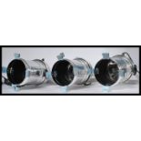 A set of three chromed Eurolite theatre / spot lights of usual form with fixing points / brackets to