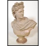 A good composite bust of Apollo raised on a pedestal base with incised name to front. Modeled with