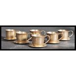 A set of six sterling silver demitasse small coffee cups / cans with matching saucers. Each cup of