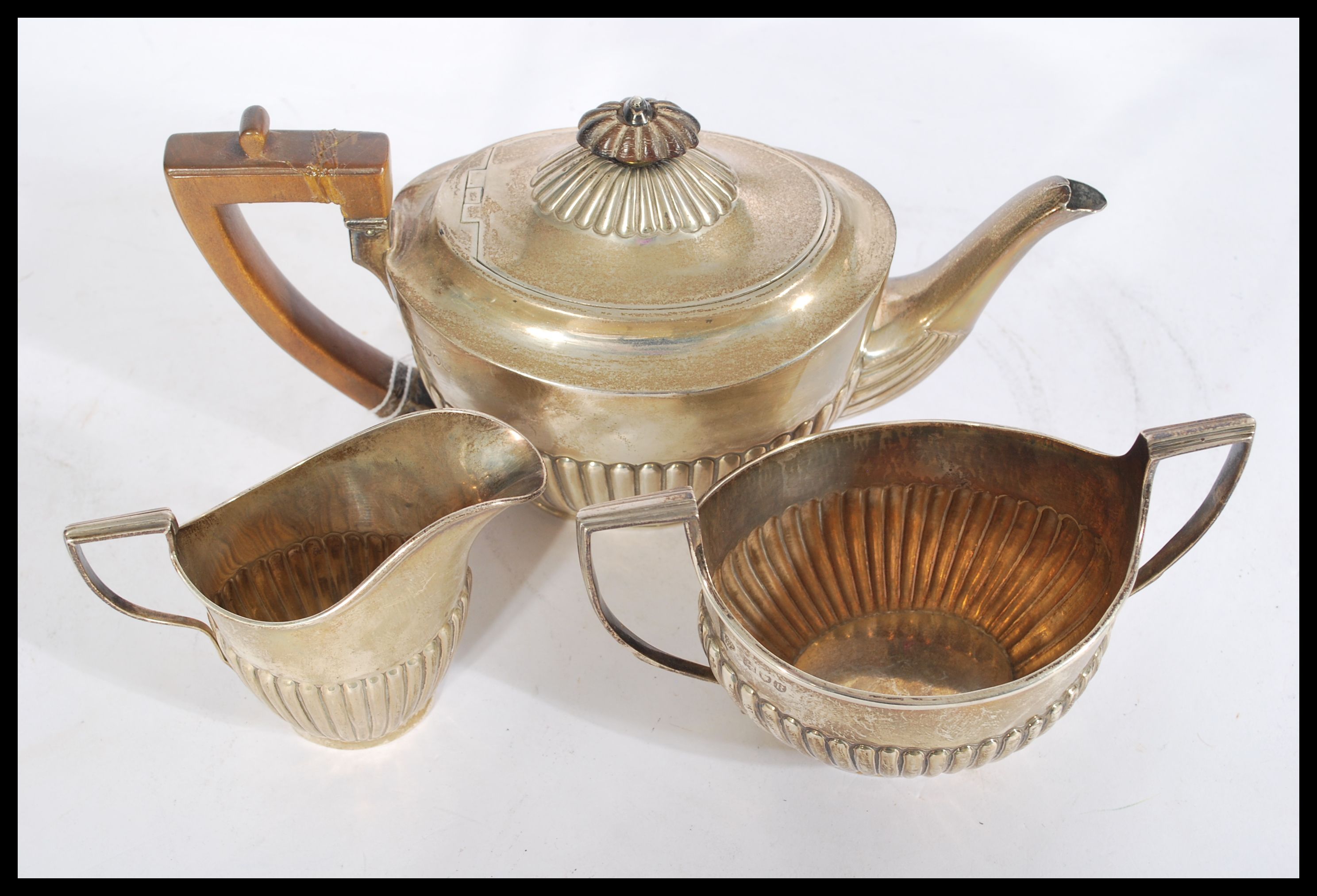 A silver hallmarked three piece boat shaped matched tea service having a part fluted gadrooned - Image 3 of 8