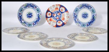 A group of early 20th century Royal Worcester cabinet plates in the fide et fiducia pattern with