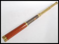 A vintage early 20th century Cary of London three draw brass telescope signed Cary with partial